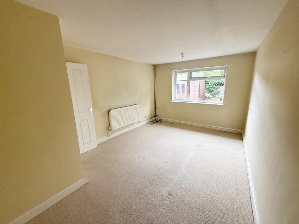 Lot: 134 - SEMI-DETACHED BUNGALOW FOR IMPROVEMENT - Bedroom 1 with garden to the rear